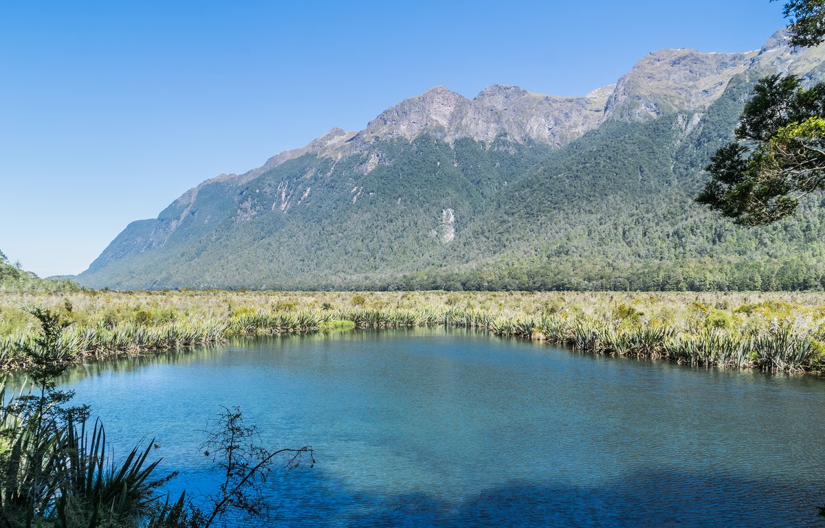 The Earl Mountains reflected in the still water of Mirror Lakes, Eglinton Valley