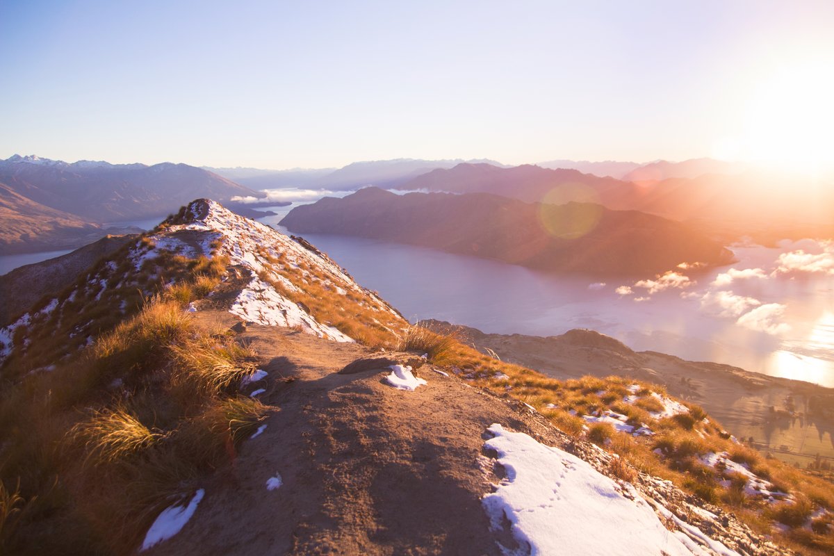 Sunrise over Lake Wanaka from the ridgeline viewpoint on the Roys Peak Track