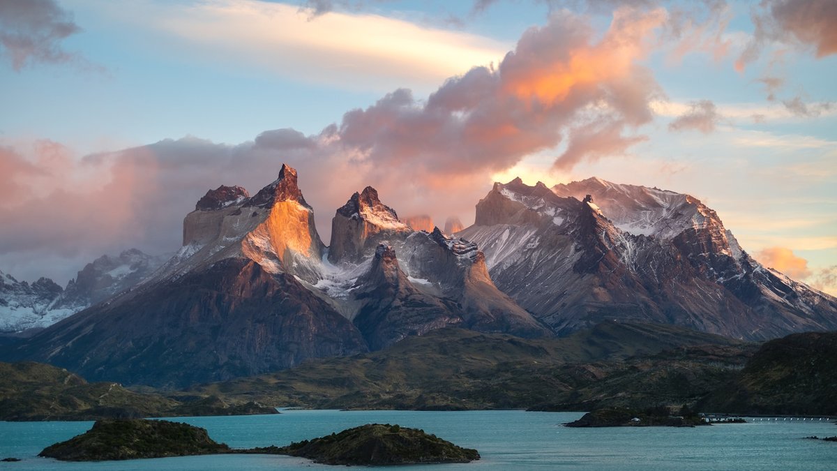 Cuernos del Paine catching first light above Lago Pehoé, Torres del Paine National Park, Chile