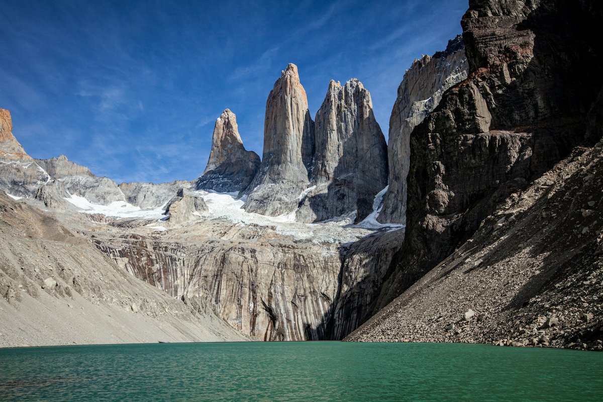The three granite towers above the glacial tarn at Mirador Base de las Torres, Torres del Paine